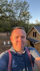 Richard Hockett, hands-on and dedicated, working tirelessly on a job site to guarantee the successful completion of a roofing project.