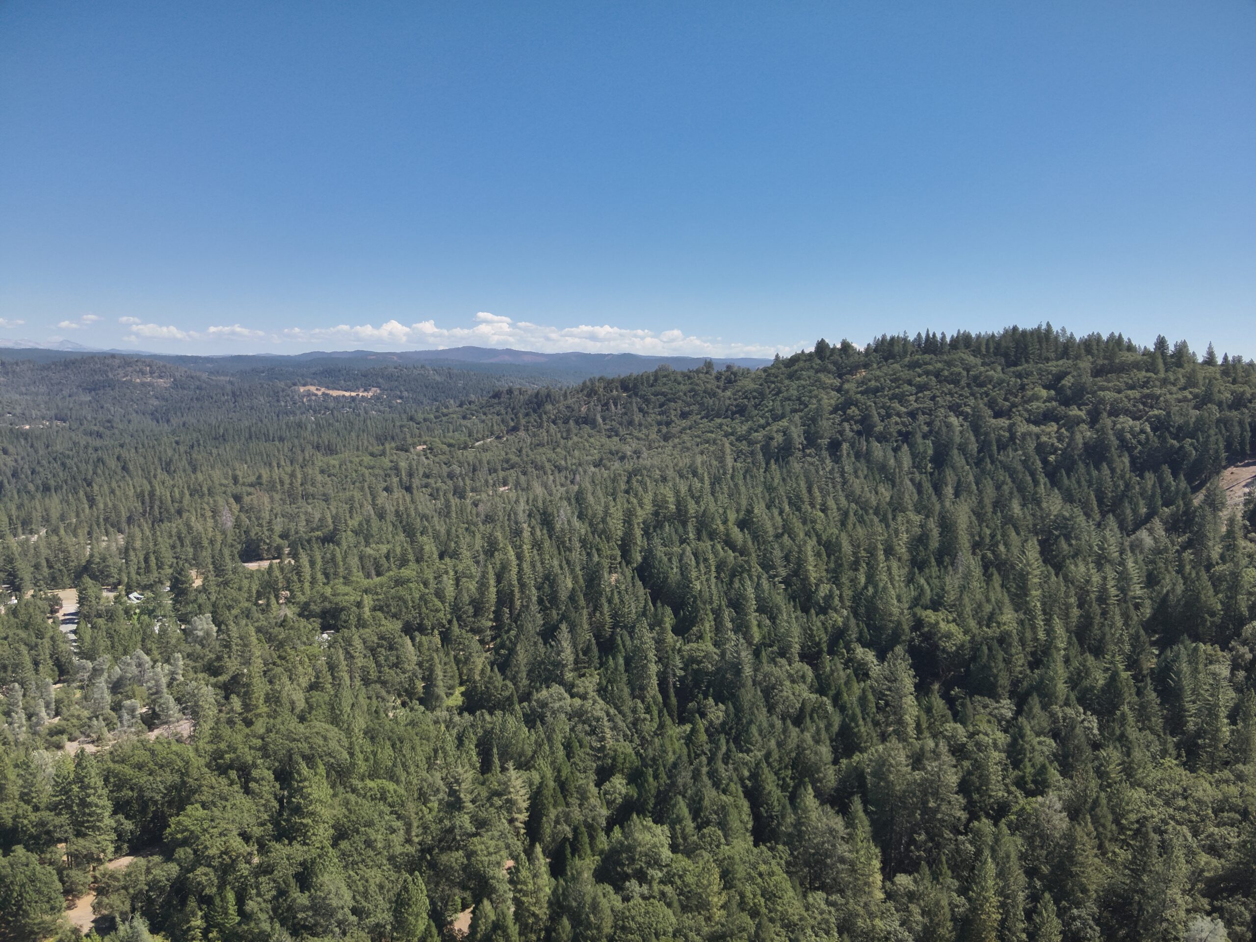 Spectacular aerial view of El Dorado County captured by Richard Hockett Roofing, highlighting the stunning landscapes and our roofing projects in the area.