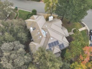 drone view of aging roof in Placerville showing wear and areas affecting roof replacement cost