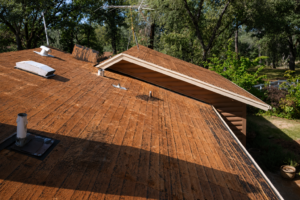 Illustrative example of hidden roof deck wood rot uncovered after tear-off.
